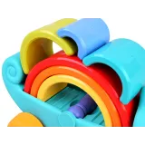 fioletowy wałeczek obok intensywnie kolorowych elementów układanki