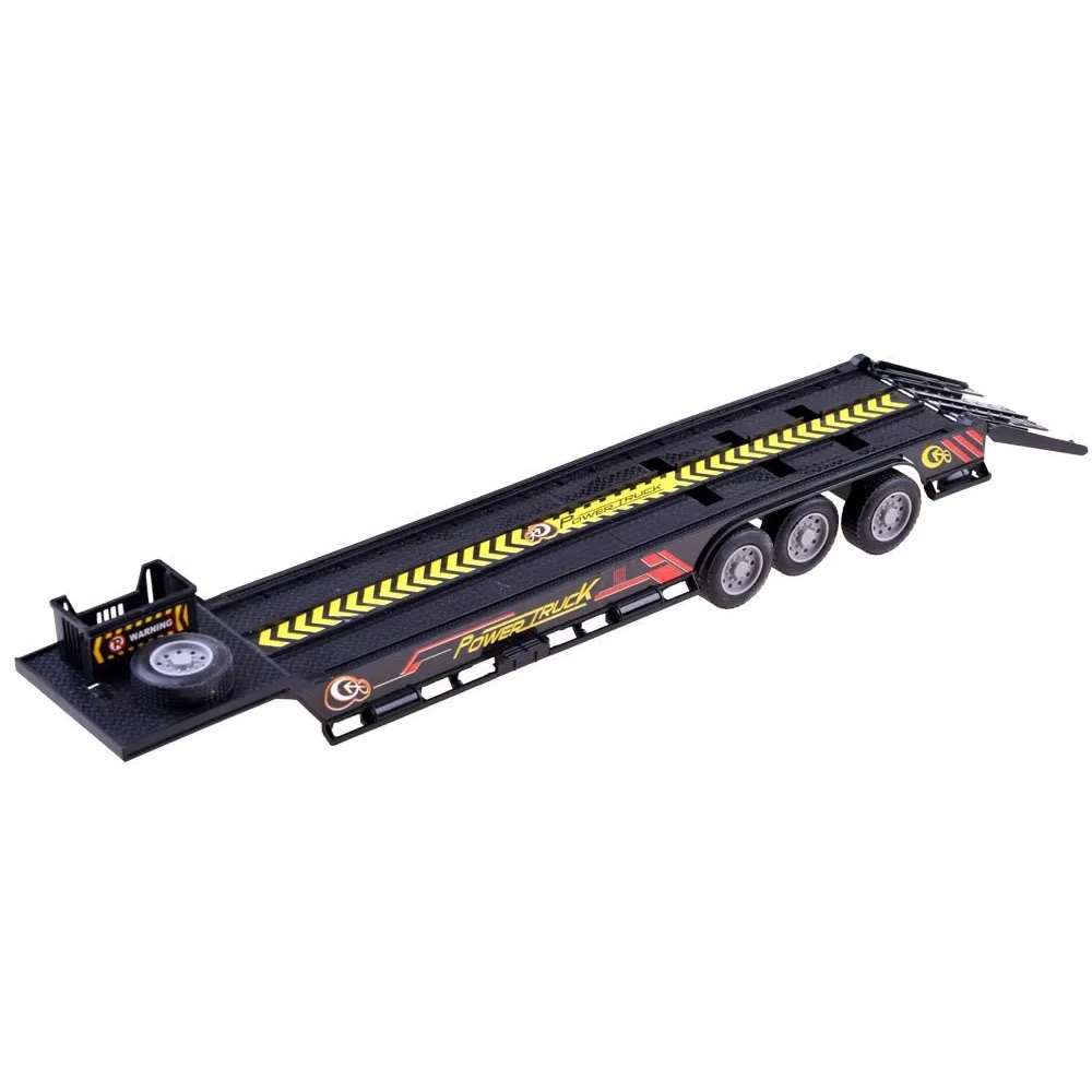 Scena z ładowania traktora na lawetę widoczna z góry