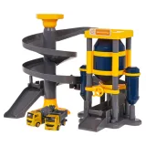 Plac budowy z silosem, zjeżdżalnią i pojazdami w widoku z góry