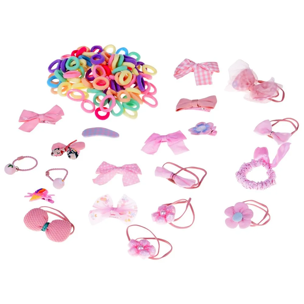 różnokolorowe mini gumeczki do włosów ułożone przy szkatułce