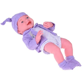 fioletowy komplet ubranek lalki ułożony obok niej