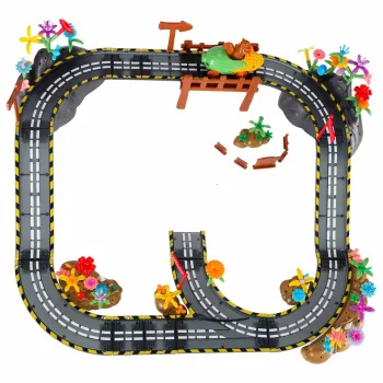 153 elementy zestawu rozłożone na stole do budowy toru