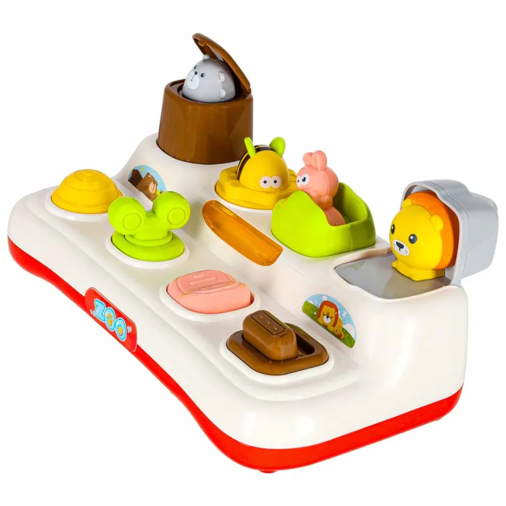 Radosne dziecko bawiące się wyskakującymi zwierzątkami