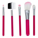 wnętrze kuferka z imitacją kosmetyków, rozłożone na jasnej powierzchni