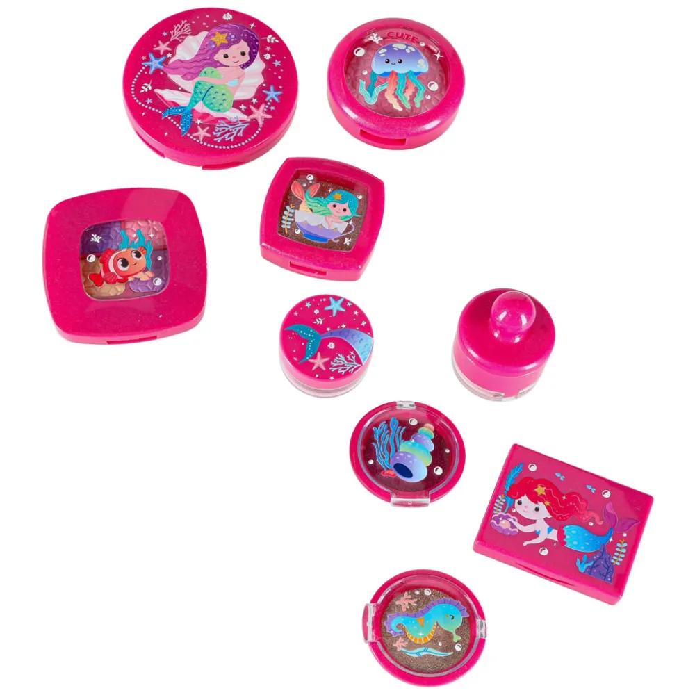 dłoń dziecka bawiąca się pędzelkiem z zestawu służącym do makijażu