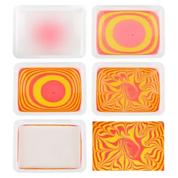 narzędzia do ebru: pipety, szpilki, pęseta na tle butelki z koncentratem