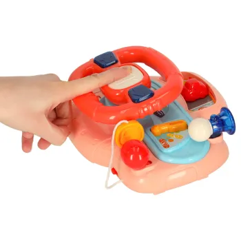 Panel z przyciskami i pokrętłami na kierownicy dziecięcej