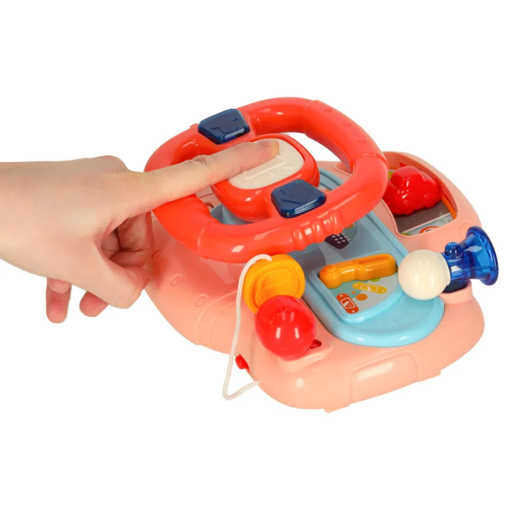 Panel z przyciskami i pokrętłami na kierownicy dziecięcej