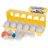 Otwarte jajko z widocznymi kolorowymi elementami wewnątrz